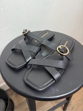 Stuart Weitzman Black Leather Crisscross Slide Sandals with Gold Ring